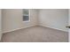 Bedroom featuring carpet flooring, neutral paint, and natural light from window at 943 Van Loon Ct, Kissimmee, FL 34758