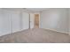 Bedroom with neutral carpet and walls, and closet with bi-fold doors at 943 Van Loon Ct, Kissimmee, FL 34758
