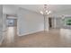 Open concept dining room with chandelier at 943 Van Loon Ct, Kissimmee, FL 34758