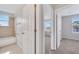 Hallway view of bathroom and bedroom featuring carpeted floors at 943 Van Loon Ct, Kissimmee, FL 34758