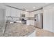 Close up of modern kitchen, featuring granite countertops and stainless steel appliances at 943 Van Loon Ct, Kissimmee, FL 34758