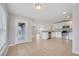 Bright kitchen features white cabinets, granite countertops, and stainless steel appliances at 943 Van Loon Ct, Kissimmee, FL 34758