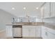 Bright, open kitchen with granite countertops and stainless steel dishwasher at 943 Van Loon Ct, Kissimmee, FL 34758