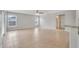 Bright, open living area with tile flooring and large windows, enhancing natural light at 943 Van Loon Ct, Kissimmee, FL 34758