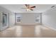 Open living area with tile flooring, ceiling fan, and access to the backyard at 943 Van Loon Ct, Kissimmee, FL 34758