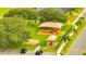A playground offers children a place to have fun, with sunshades and play structures in a green space at 943 Van Loon Ct, Kissimmee, FL 34758