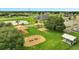 A community playground with green spaces and play structures at 943 Van Loon Ct, Kissimmee, FL 34758