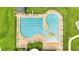 Aerial view of a community pool featuring lap lanes and a splash pad with lounge chairs at 943 Van Loon Ct, Kissimmee, FL 34758