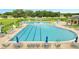 Community pool features a splash pad and plenty of lounge chairs for the residents at 943 Van Loon Ct, Kissimmee, FL 34758