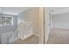 Staircase landing with window and carpet at 943 Van Loon Ct, Kissimmee, FL 34758