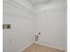 A simple walk-in closet with wire shelves and flooring at 943 Van Loon Ct, Kissimmee, FL 34758
