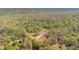 Scenic aerial view of a wooded landscape featuring a single-Gathering home, illustrating a serene setting at 953 Baron Rd, Orlando, FL 32828