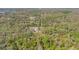 Aerial perspective of a wooded lot with a single-Gathering home amidst dense trees and vegetation at 953 Baron Rd, Orlando, FL 32828