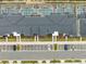Townhome community aerial showcases private pools, lush landscaping, and organized parking at 1048 Leader St, Davenport, FL 33896