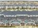 Aerial view of townhome community with private pools, landscaped grounds, and ample parking spaces at 1048 Leader St, Davenport, FL 33896