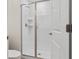 Clean bathroom featuring walk-in shower with glass door, white subway tile, and modern fixtures at 1048 Leader St, Davenport, FL 33896