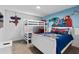 Fun ' bedroom with bunk beds and superhero-themed decor on the walls and bedding at 1048 Leader St, Davenport, FL 33896