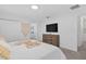 Bright and airy bedroom with neutral tones, a comfortable bed, and ample closet space at 1048 Leader St, Davenport, FL 33896