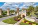 ChampionsGate entrance showcasing manicured grounds, multiple entryways, and community signage at 1048 Leader St, Davenport, FL 33896