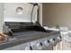 Outdoor kitchen features a Nexgrill grill with patio table for convenient outdoor dining and entertaining at 1048 Leader St, Davenport, FL 33896