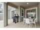Outdoor patio with dining table and grill, perfect for enjoying outdoor meals at 1048 Leader St, Davenport, FL 33896