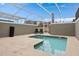 Inviting screened-in private pool for leisure, surrounded by spacious patio, offering a cool retreat at 1048 Leader St, Davenport, FL 33896