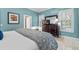 Comfortable bedroom with cool color palette, shuttered windows, and dark wood dresser at 1154 Celebration Ave, Celebration, FL 34747