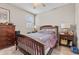 Well-lit bedroom featuring a wood-framed bed, a dresser, and matching bedside tables at 1154 Celebration Ave, Celebration, FL 34747