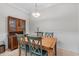 Classic dining room featuring wood table, chairs, wainscotting, and decorative hutch at 1154 Celebration Ave, Celebration, FL 34747