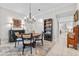 Inviting dining room with a round table, chandelier, and elegant decor at 1154 Celebration Ave, Celebration, FL 34747