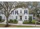 Charming home featuring black shutters, a welcoming front porch, and a decorative wreath on the door at 1154 Celebration Ave, Celebration, FL 34747