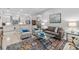 Open-concept living area with tile flooring, comfortable seating, and access to the kitchen at 1154 Celebration Ave, Celebration, FL 34747