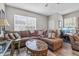 Spacious living room with a large sectional, modern coffee table, and a work-from-home area at 1154 Celebration Ave, Celebration, FL 34747