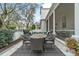 The outdoor space features a dining area, a fire pit, and a covered screened-in patio for relaxing and entertaining at 1154 Celebration Ave, Celebration, FL 34747