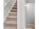 Carpeted staircase with neutral color palette at 1154 Celebration Ave, Celebration, FL 34747