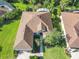 Aerial view of the roof and well-maintained landscaping around the property at 133 Indian Wells Ave, Kissimmee, FL 34759