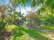 Expansive backyard with well-manicured lawn and mature trees at 133 Indian Wells Ave, Kissimmee, FL 34759