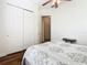 Bedroom features wood flooring, closet, and access to ensuite bathroom at 133 Indian Wells Ave, Kissimmee, FL 34759