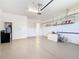 Spacious two car garage with epoxy floor, water heater, and shelving at 133 Indian Wells Ave, Kissimmee, FL 34759