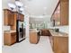 Spacious kitchen with stainless steel appliances, center island, and granite countertops at 133 Indian Wells Ave, Kissimmee, FL 34759