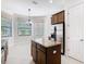Kitchen featuring a center island, stainless steel appliances, granite countertops, and a breakfast nook at 133 Indian Wells Ave, Kissimmee, FL 34759