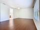 Bright main bedroom featuring laminate floors, ceiling fan and large window at 133 Indian Wells Ave, Kissimmee, FL 34759