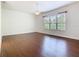 Large main bedroom features laminate floors, ceiling fan, and large window at 133 Indian Wells Ave, Kissimmee, FL 34759