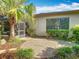 Private patio area featuring brick pavers and lush landscaping at 133 Indian Wells Ave, Kissimmee, FL 34759