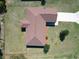 Aerial view of roof, driveway, landscaping, lawn, and fencing at 15069 Sw 29Th Avenue Rd, Ocala, FL 34473