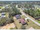 Picturesque aerial shot of a quiet neighborhood surrounded by mature trees and landscaped yards at 15069 Sw 29Th Avenue Rd, Ocala, FL 34473