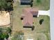 Aerial shot of home showing the roof, driveway, landscaping and fenced yard at 15069 Sw 29Th Avenue Rd, Ocala, FL 34473