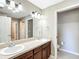 Bright bathroom with double sinks, framed mirrors, and plenty of counter space at 15069 Sw 29Th Avenue Rd, Ocala, FL 34473