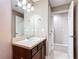 This bathroom has a vanity with a sink, a mirror, and a tiled floor at 15069 Sw 29Th Avenue Rd, Ocala, FL 34473