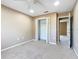 This bedroom features neutral walls and carpet, closet, and ceiling fan at 15069 Sw 29Th Avenue Rd, Ocala, FL 34473